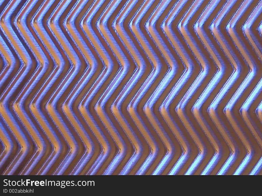 Close-up of metal plate under low light.