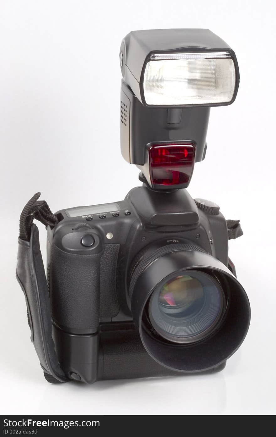 A digital single lens reflex camera with mounted flashgun. A digital single lens reflex camera with mounted flashgun