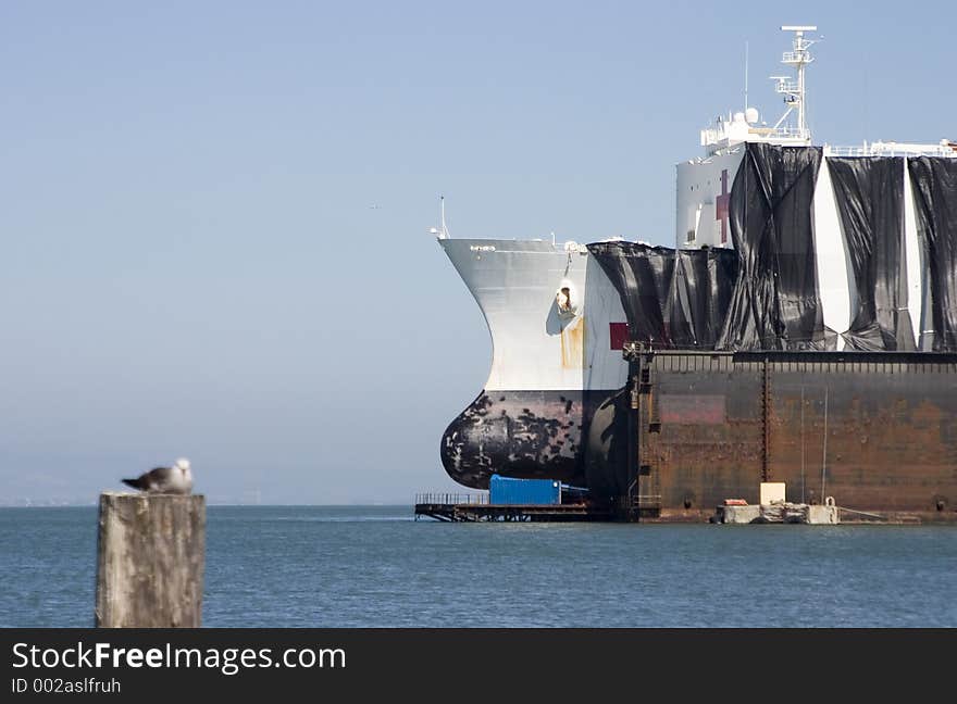 A large medical ship receives repairs in a San Franciso drydock. A large medical ship receives repairs in a San Franciso drydock.