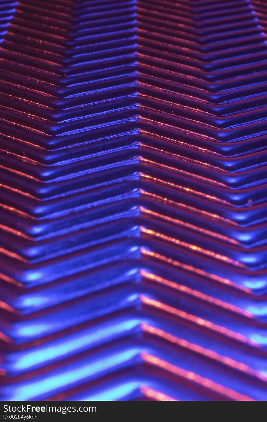 Close-up of metal plate under low light.