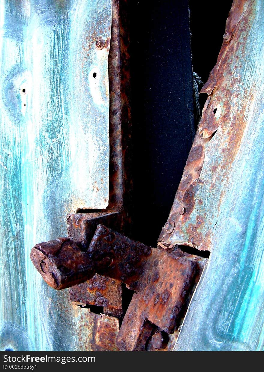 A rusty old padlock is the only think holding this abstract shed together. A rusty old padlock is the only think holding this abstract shed together.