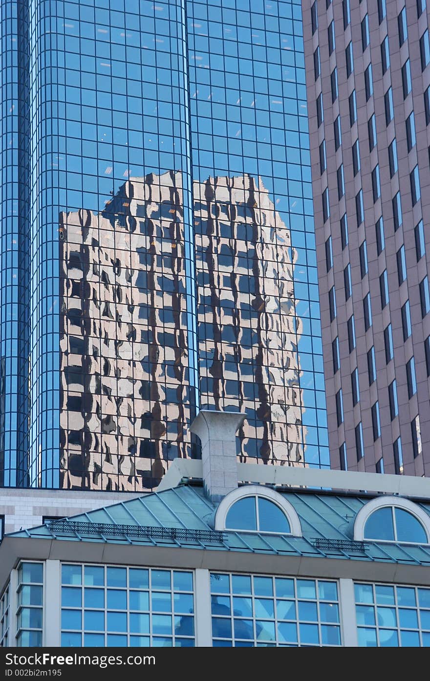 It shows the reflection of a multisory building. It shows the reflection of a multisory building