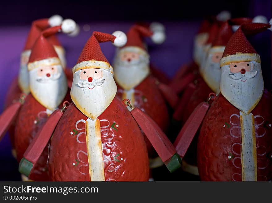 Rows Of Funny Santas For Sale On A Shelf