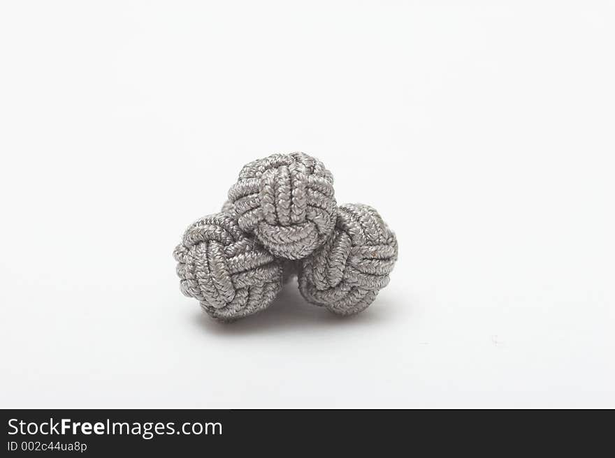 Shirt cufflinks on white background