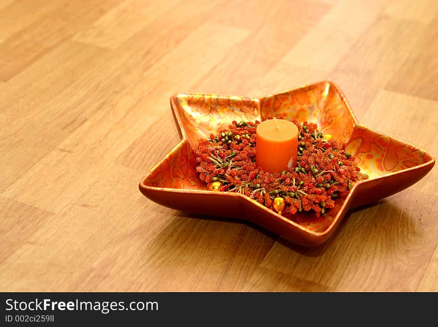 Christmas candle in a star shape bowl. Christmas candle in a star shape bowl