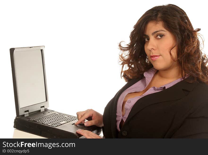 Woman types up a communication on her laptop. Woman types up a communication on her laptop