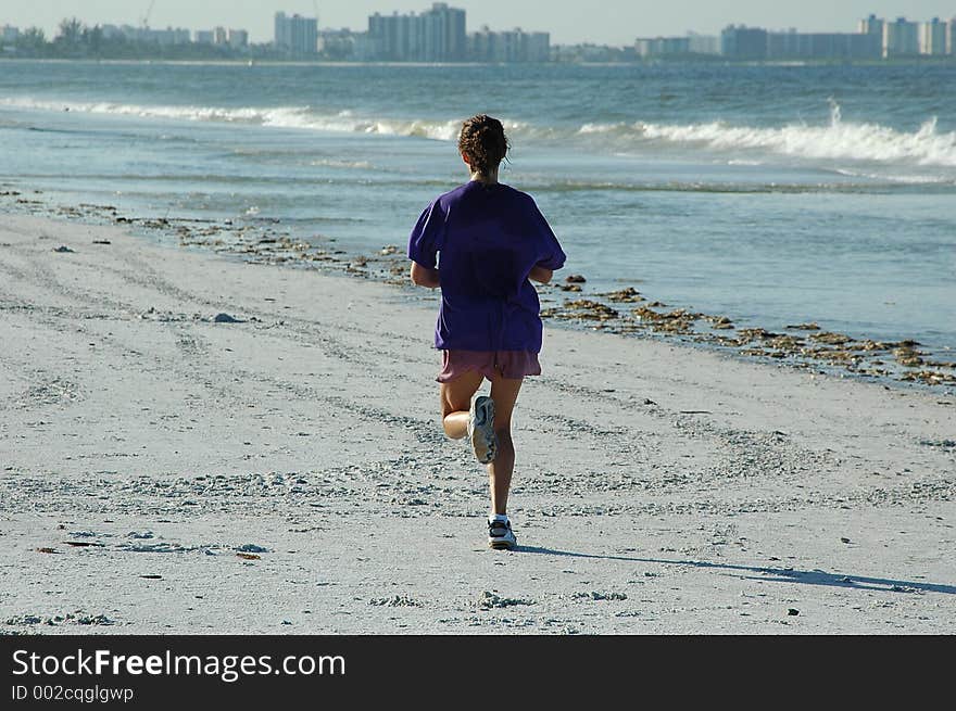 Female Jogger On The Beach