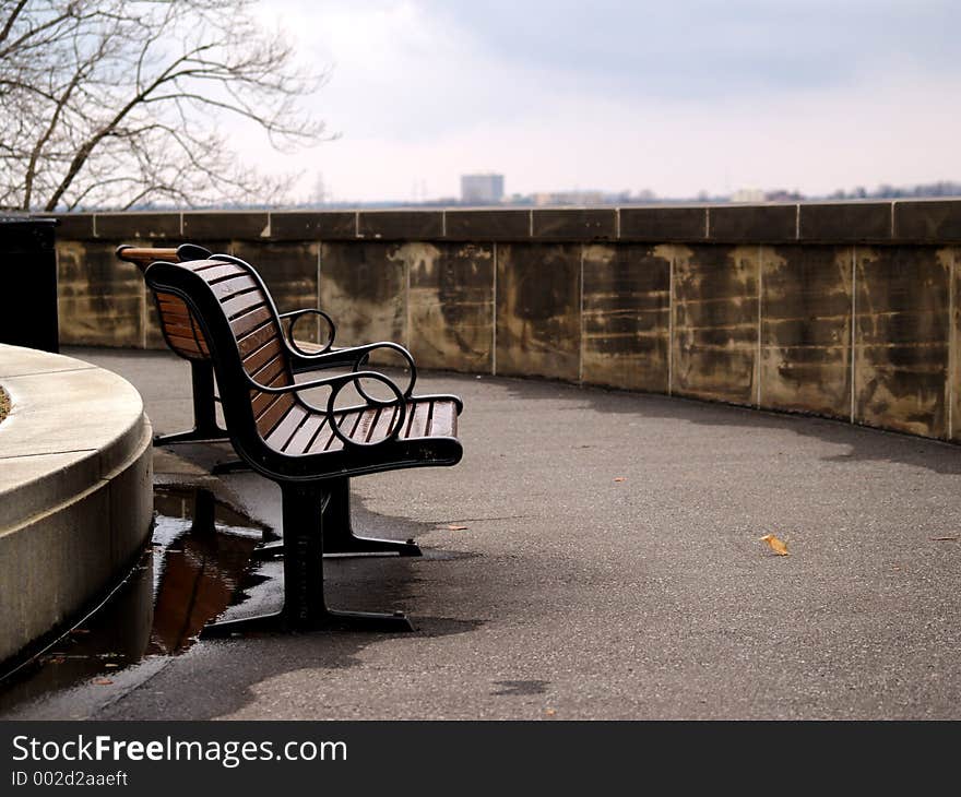 Two benches on a pathway.