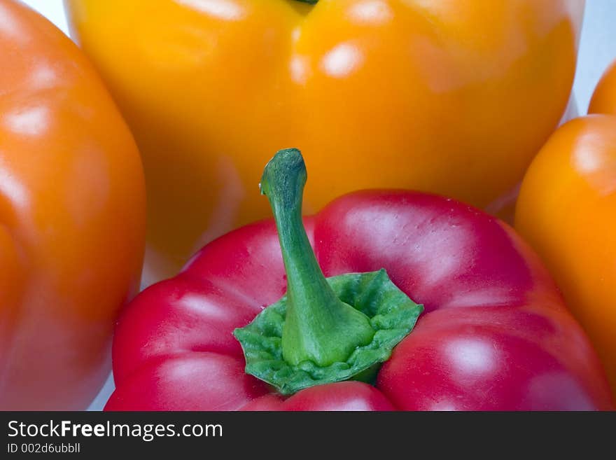 Several peppers of varying colors. Several peppers of varying colors