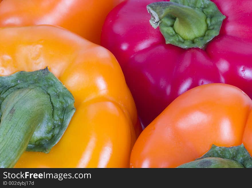 Several peppers of varying colors. Several peppers of varying colors