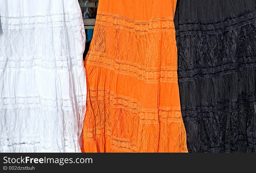 3 Coloured Dresses For Sale At A Spanish Market