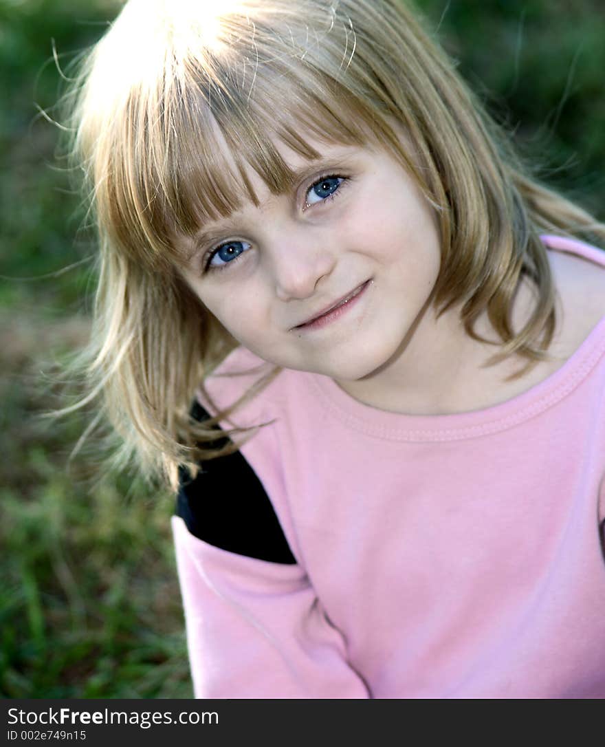 Blue Eyed Blonde Child Smiling. Blue Eyed Blonde Child Smiling