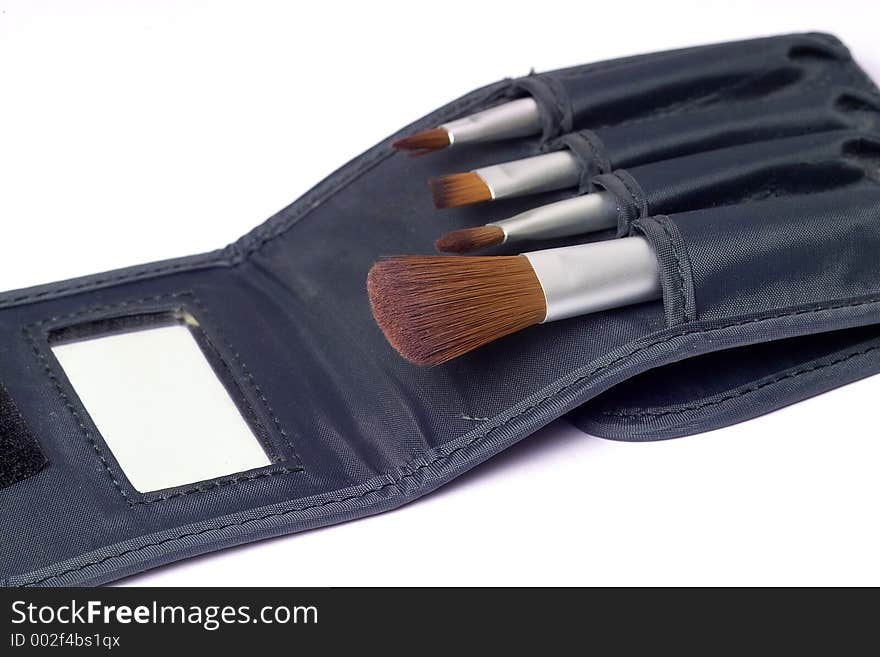 Travelling set of four make up brushes with mirror. Travelling set of four make up brushes with mirror