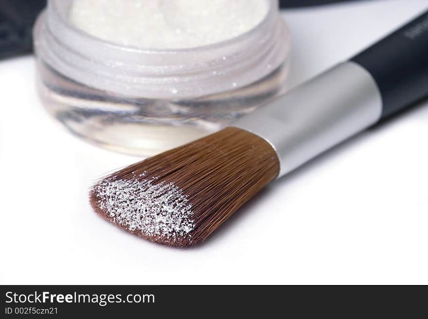 Make up brush with glittering perl powder. Make up brush with glittering perl powder