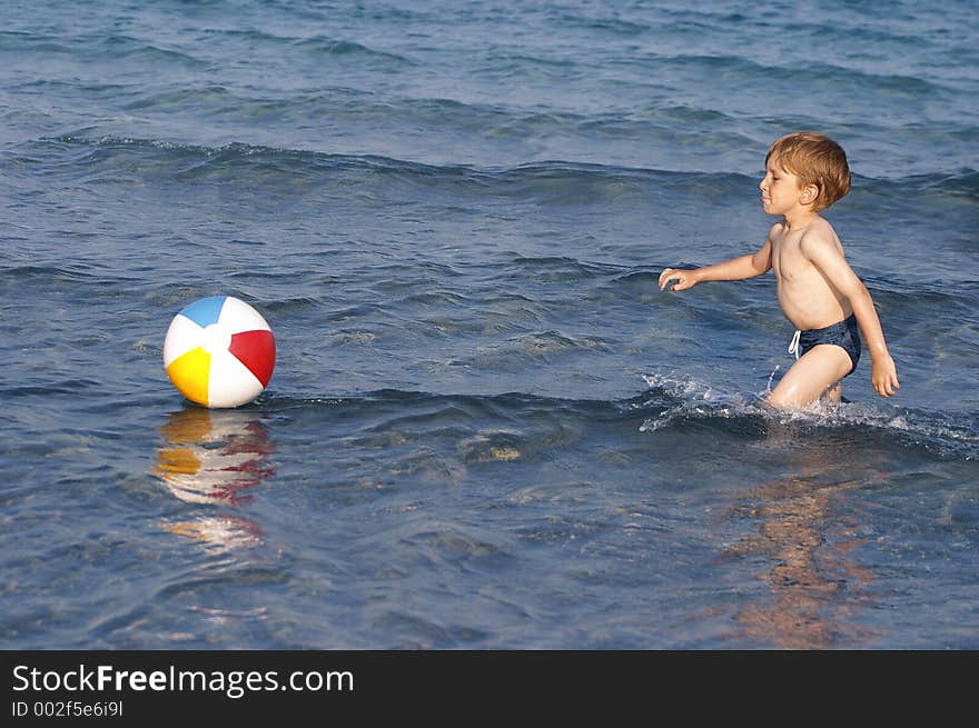 Kid playing in the water. Kid playing in the water