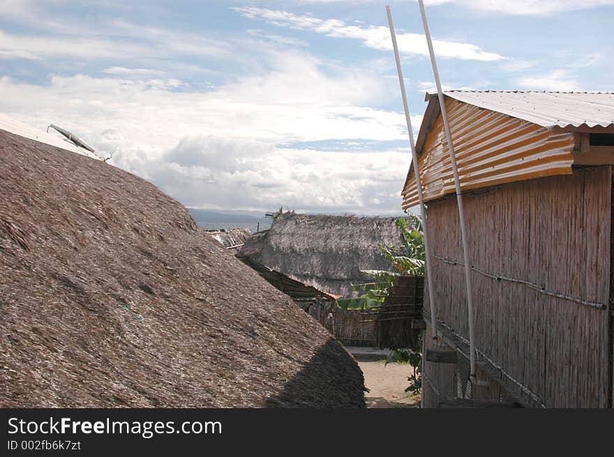 Village scene with solar panel on thatched roof 1038. Village scene with solar panel on thatched roof 1038