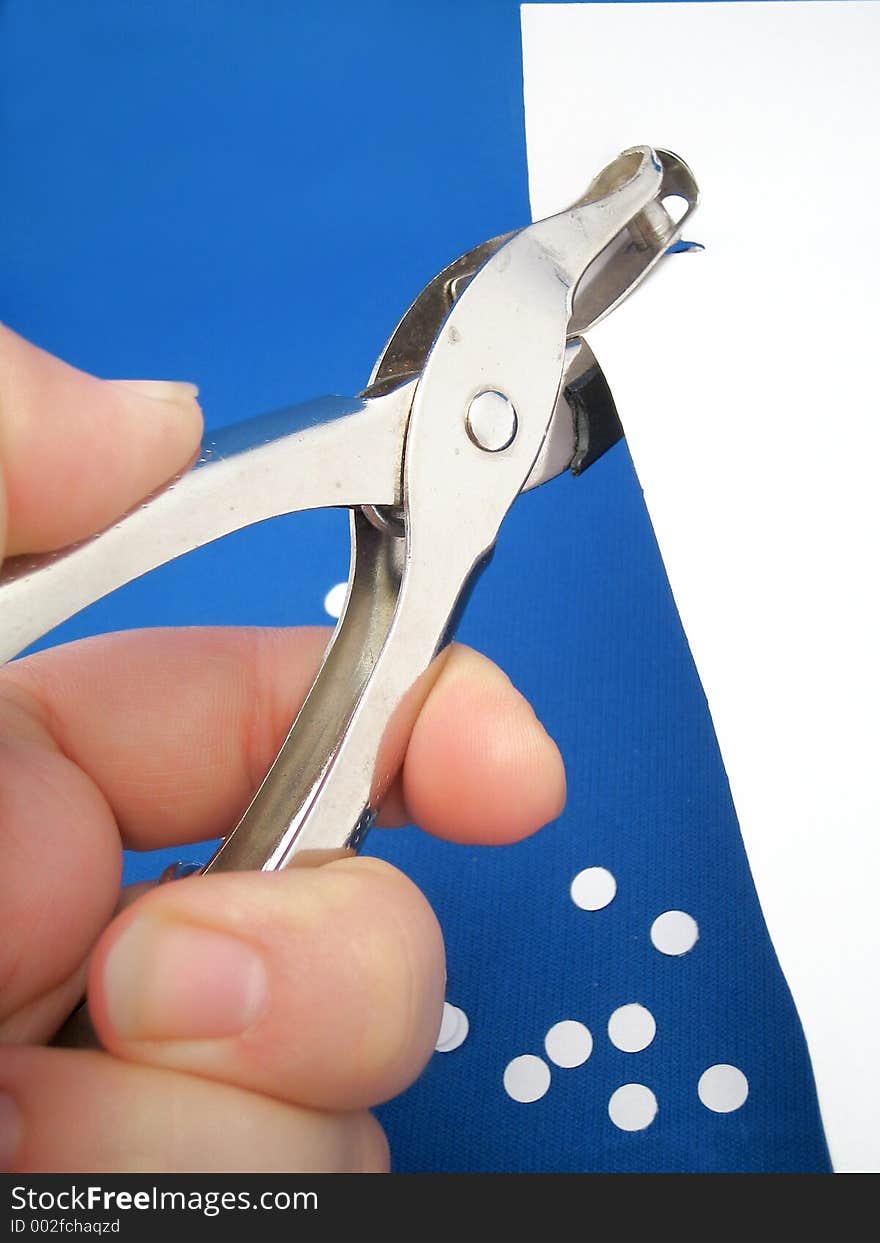 Closeup of paper hole puncher