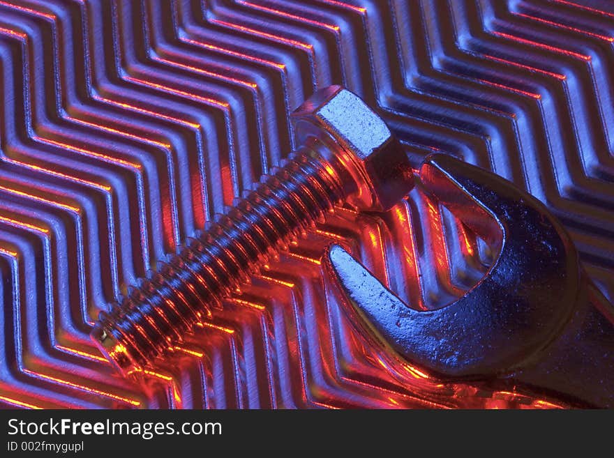 Tools on metal plate under low light. Tools on metal plate under low light.