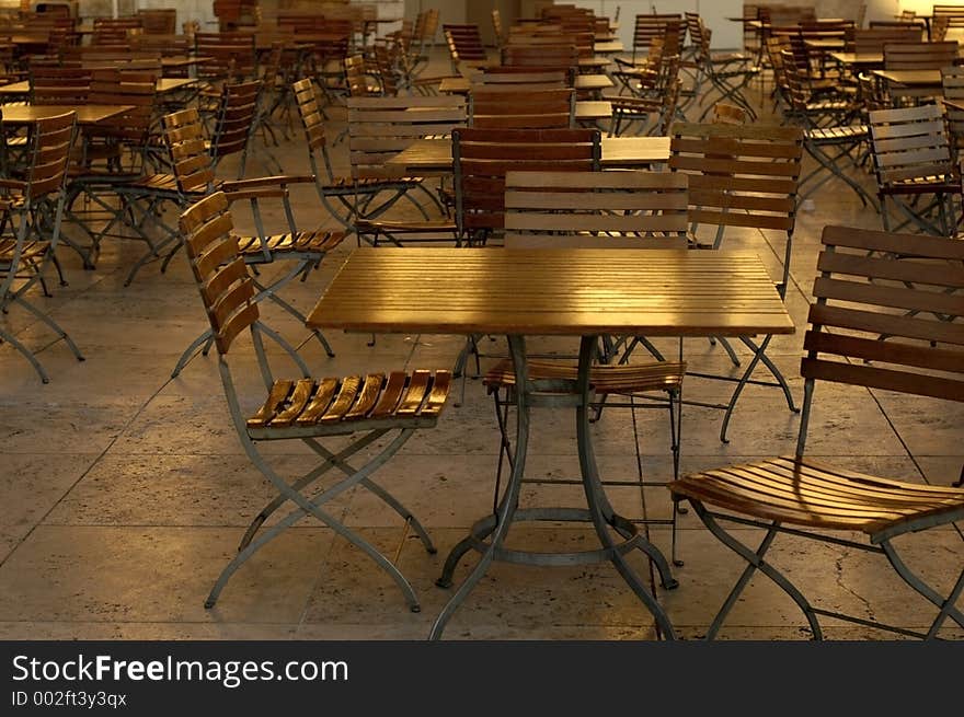 Large group of empty cafe table and chairs. Large group of empty cafe table and chairs.