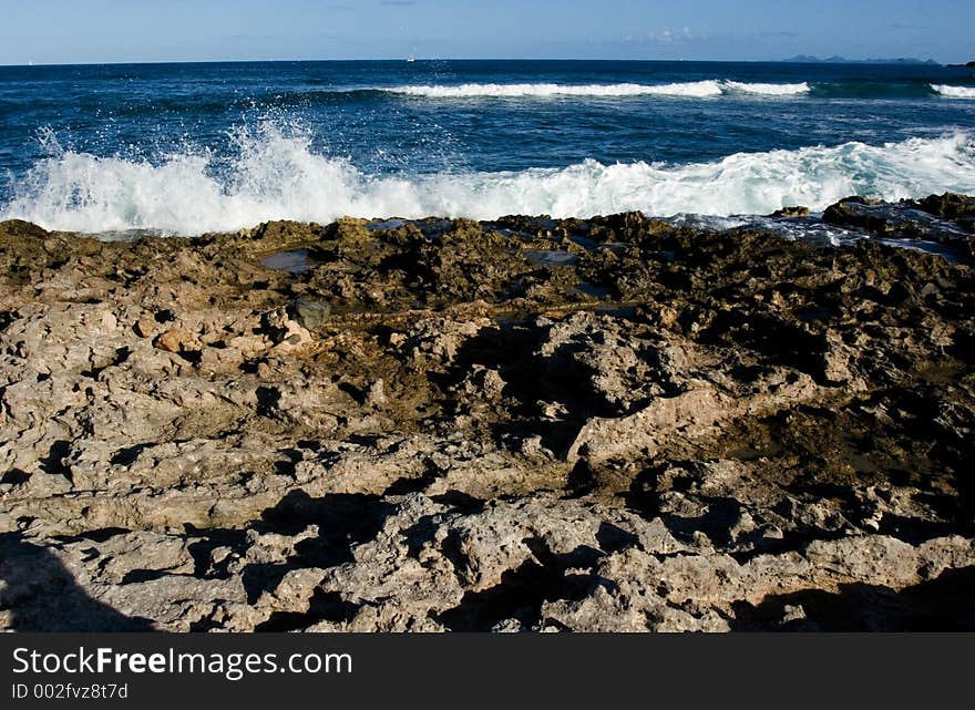 Atlantic ocean crashing into the Rocky shore of a Caribbean island. Atlantic ocean crashing into the Rocky shore of a Caribbean island