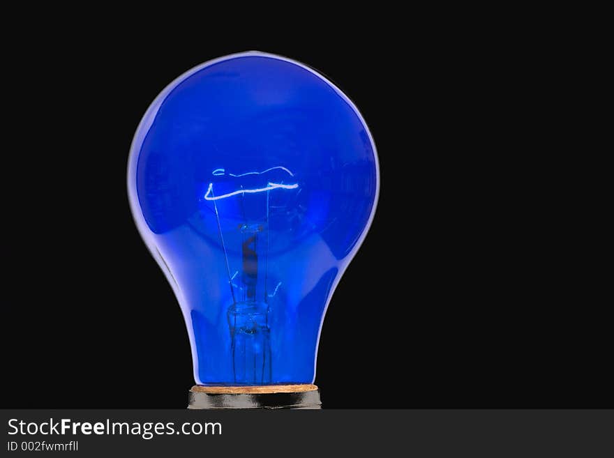 Blue light bulb - black background. Blue light bulb - black background