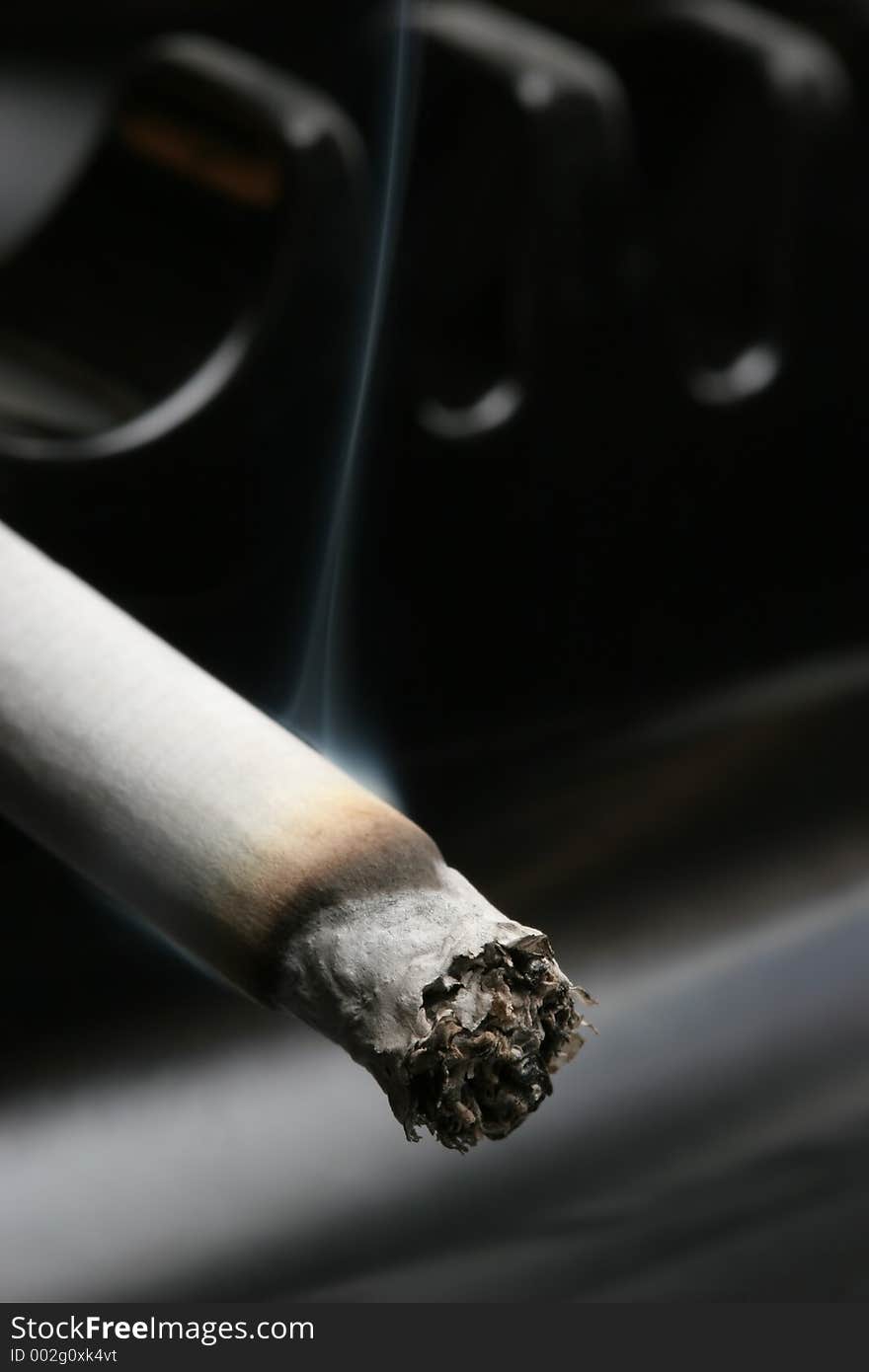 Cigarette In Ashtray