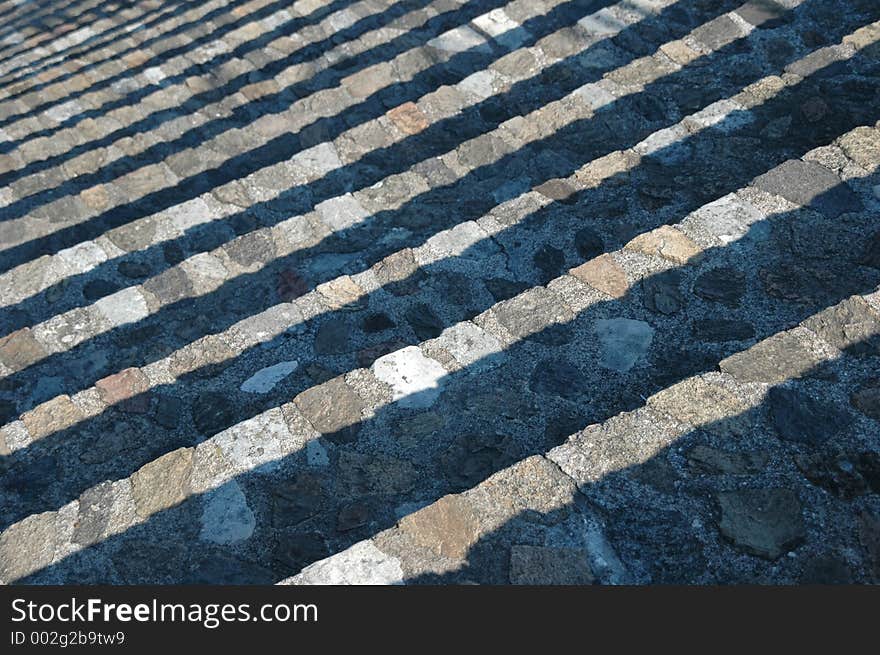 The play of light and shade - dropping down in steps in an amphitheater. The play of light and shade - dropping down in steps in an amphitheater.