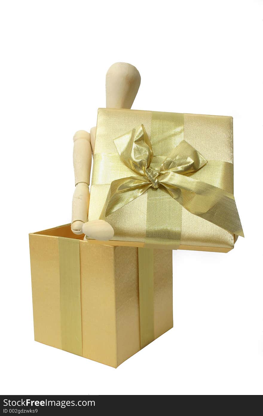 Manikin in a gift box over white. Manikin in a gift box over white