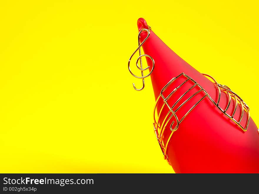 Red Christmas Ornament on a Yellow Background