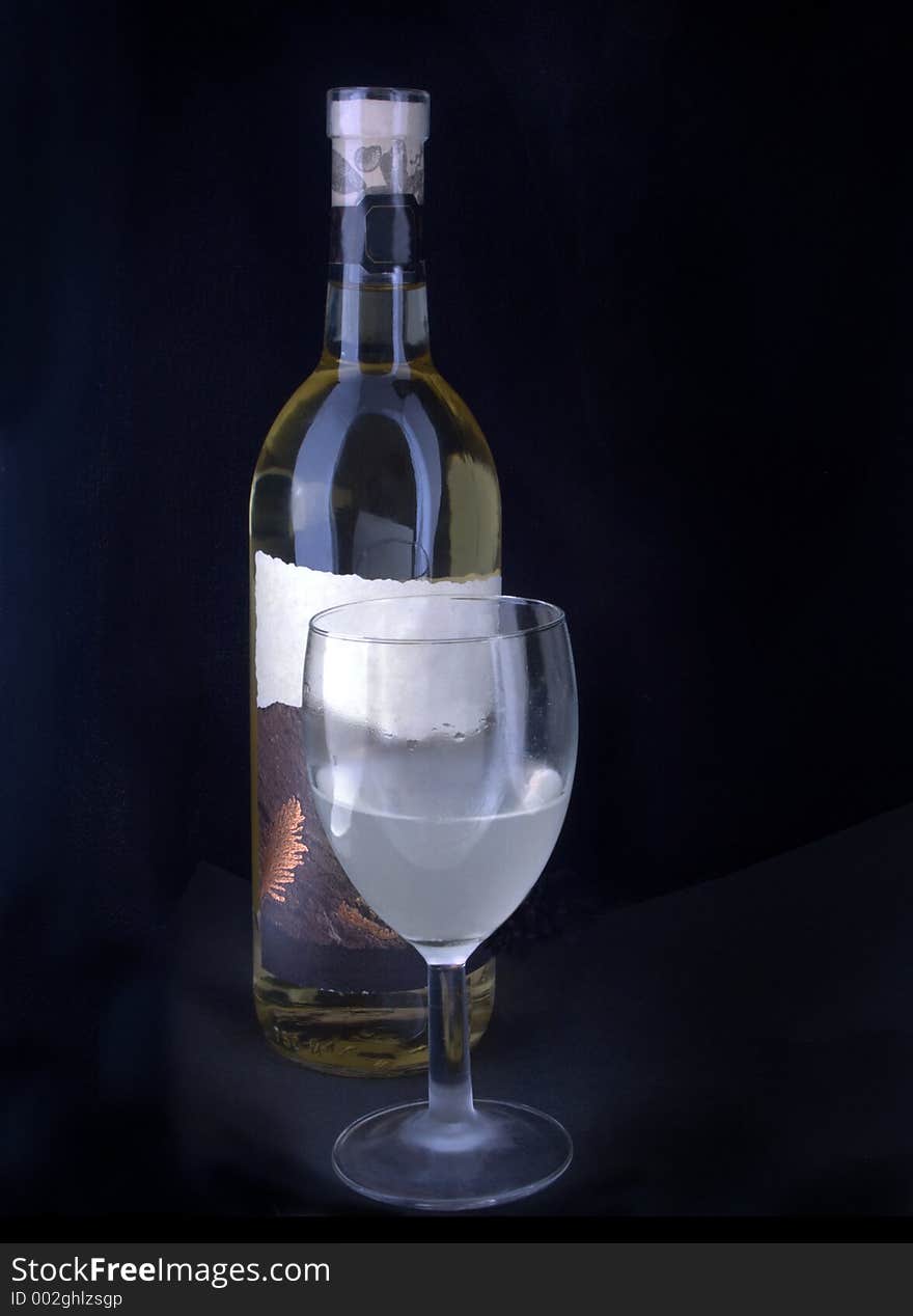 Wine bottle and coldfrosted glass. Wine bottle and coldfrosted glass