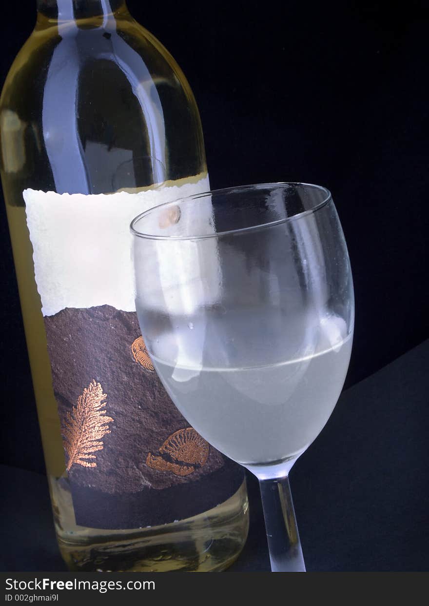 Wine bottle and coldfrosted glass. Wine bottle and coldfrosted glass