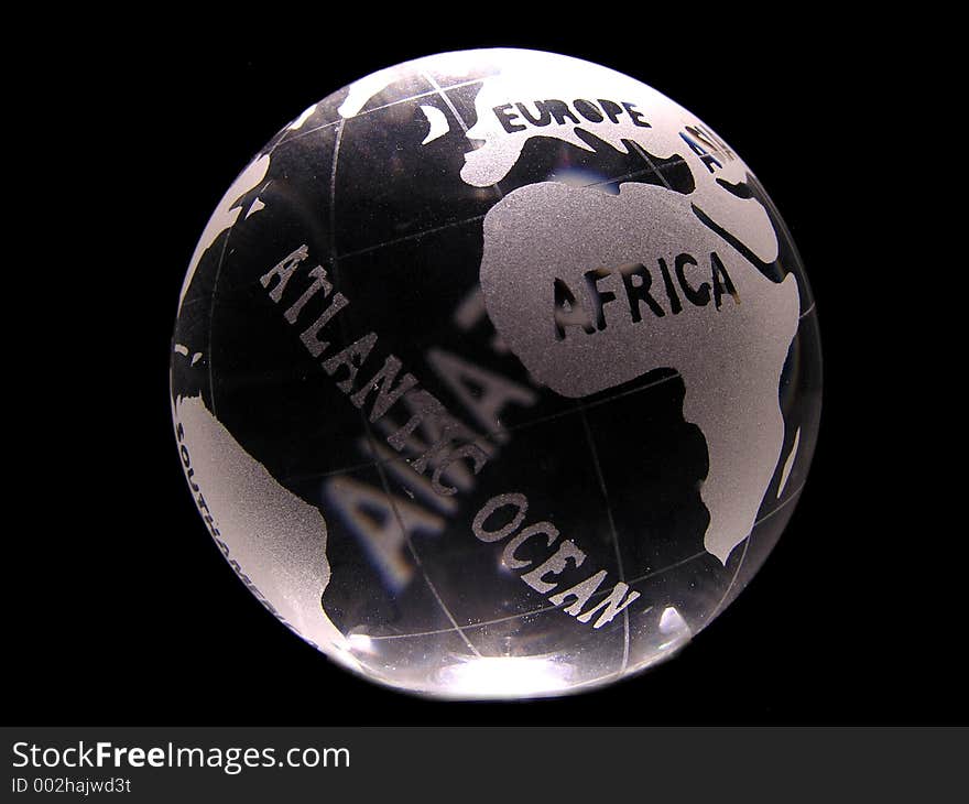 A glass globe showing africa, europe and atlantic ocean.