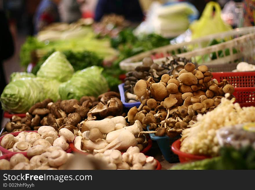 Musrooms and vegetables for sale in marketplace. Musrooms and vegetables for sale in marketplace