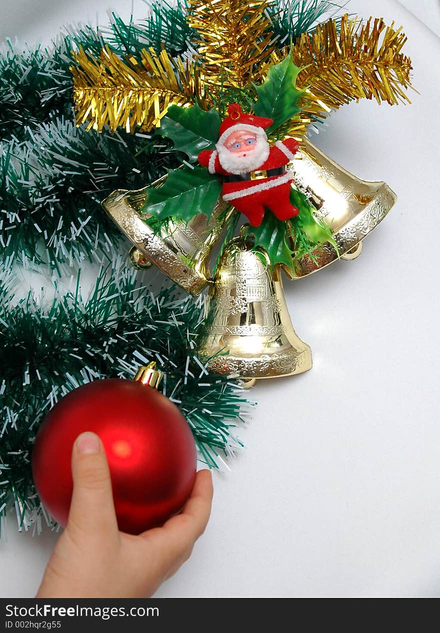 Handbells a red sphere and a bow Christmas decoration on white background