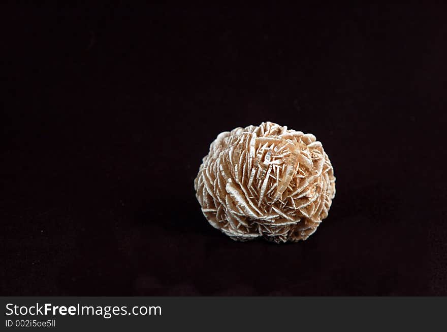 Selenite, a natural crystal formation also known as a desert rose.