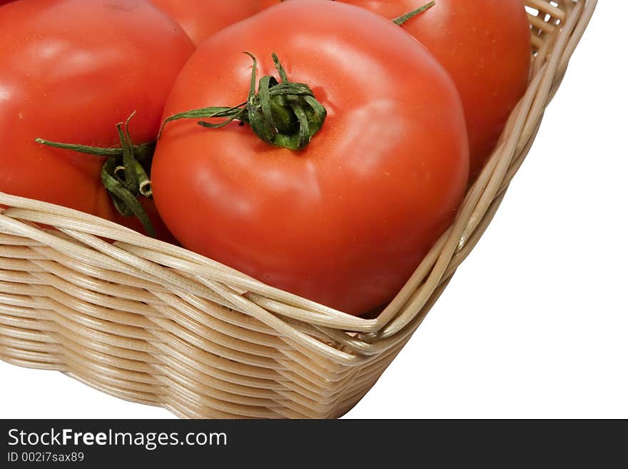 Basket with tomatoes on white background with clipping path