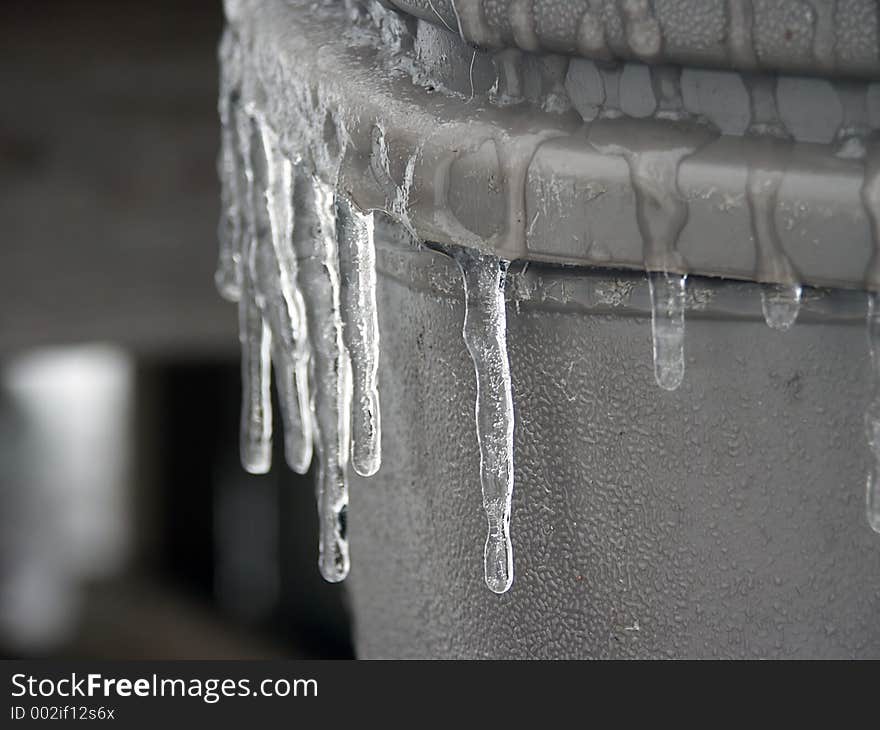 Icicles hanging of a garbage can