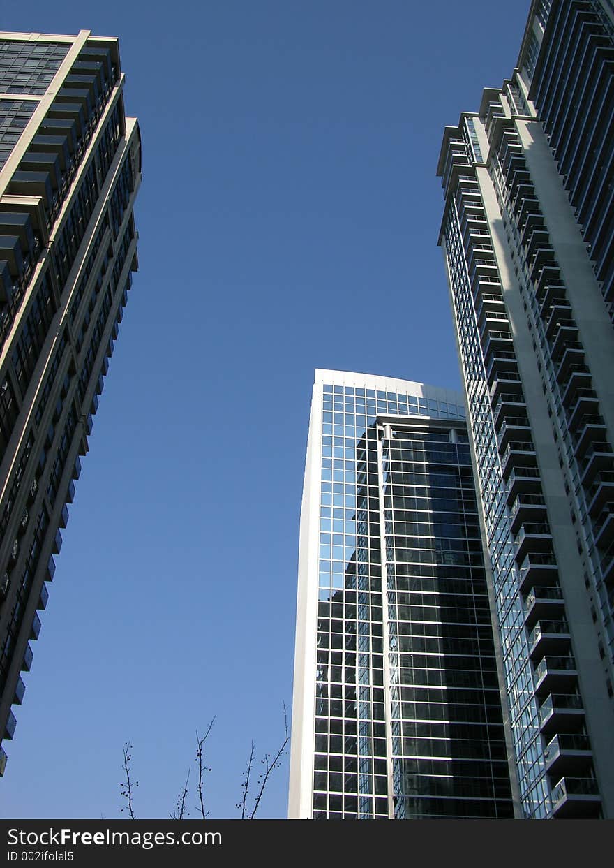 Condos and highrises crowd this street. Condos and highrises crowd this street.