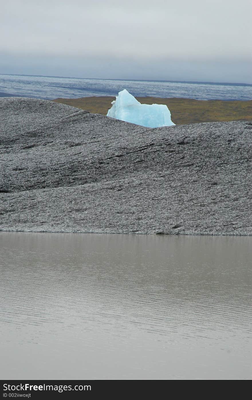 Iceberg on Rock and Water. Iceberg on Rock and Water