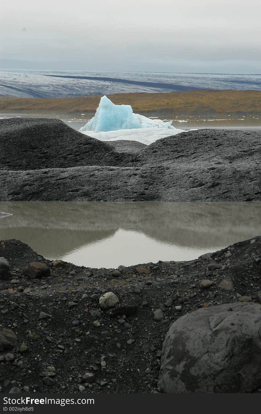 Black Rocks and Blue Iceberg. Black Rocks and Blue Iceberg