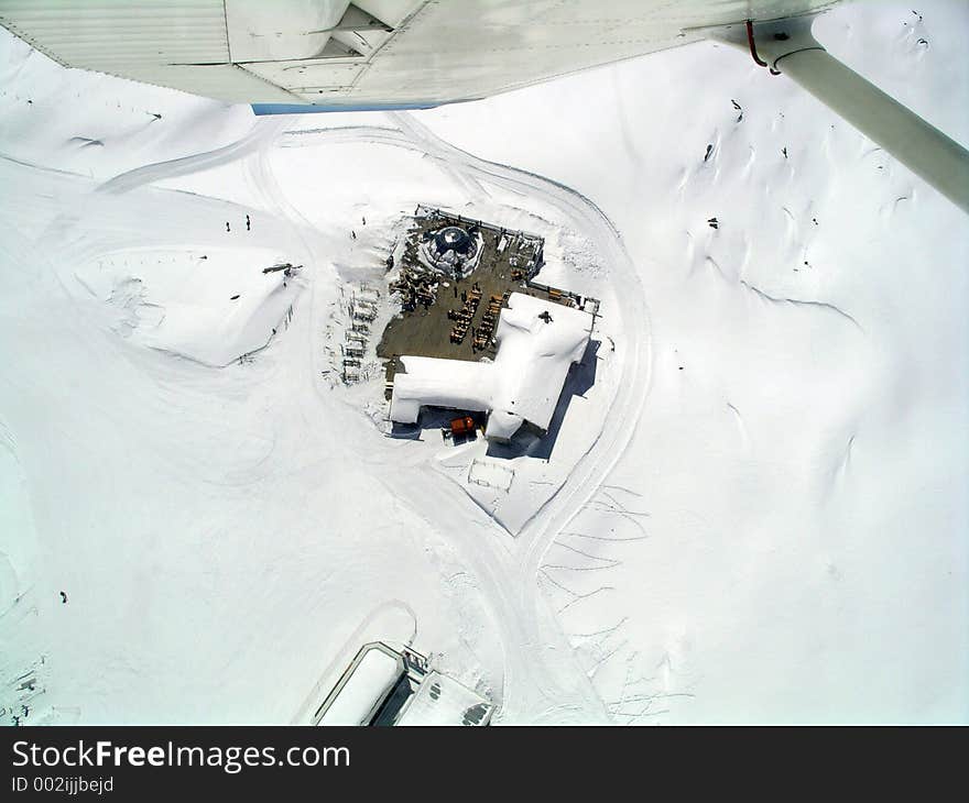 It shows a flight over a skicourse in Italy. It shows a flight over a skicourse in Italy