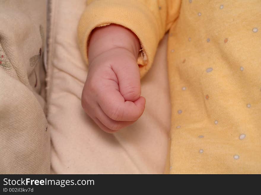 Baby hand in crib