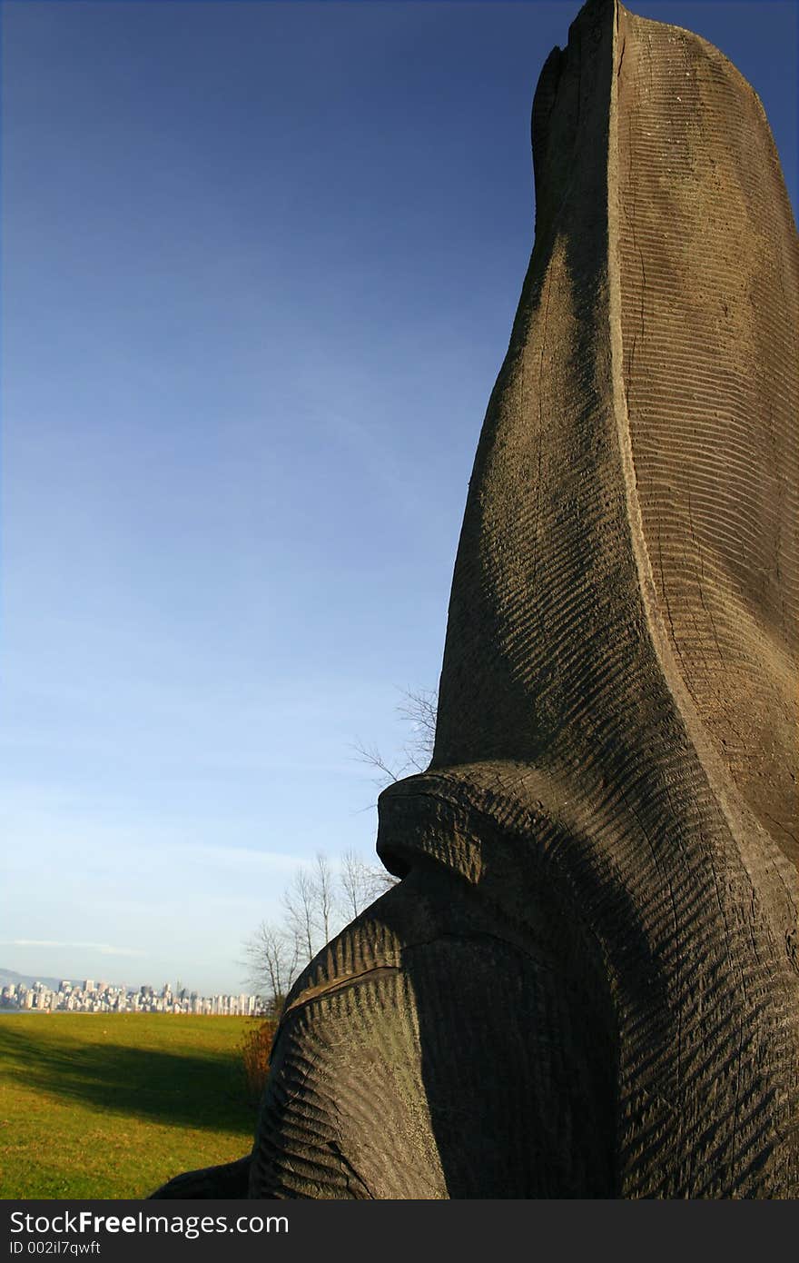 Wood sculpture over blue sky