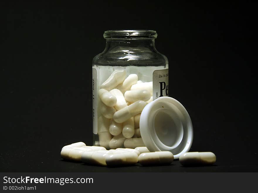 Bottle of white pills