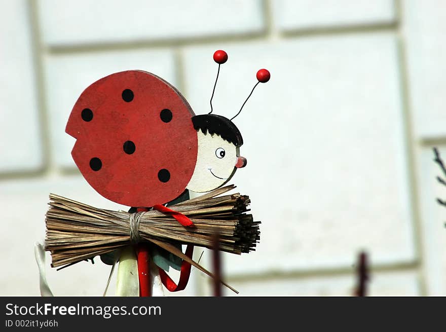 One lady bird, decoration for the garden