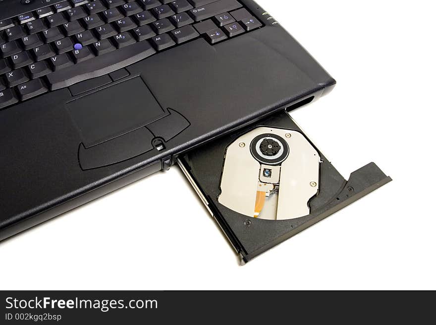 Close-up of the laptop with open optical drive in front. Isolated on white background, has room for ad or other text. Close-up of the laptop with open optical drive in front. Isolated on white background, has room for ad or other text
