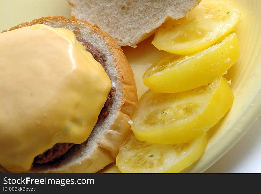 Cheeseburger with yellow tomatoes. Cheeseburger with yellow tomatoes