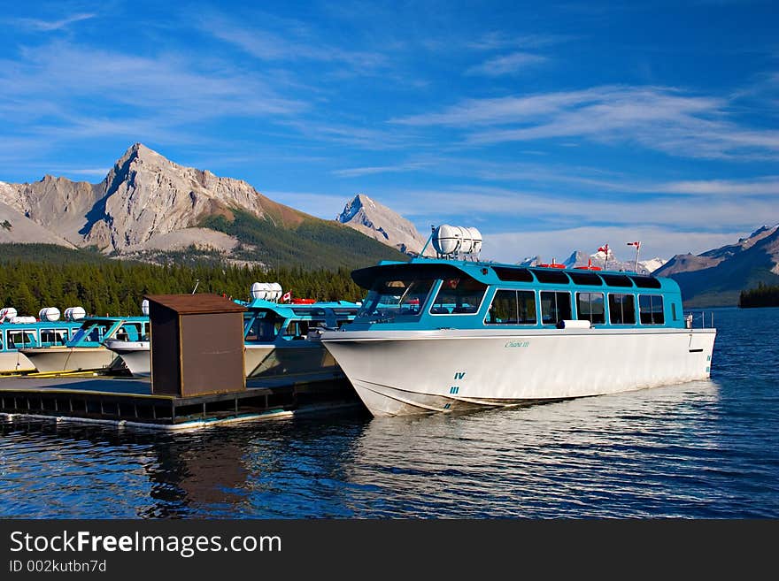 A tourist boat stays moored in its harbour at Maligne Lake, Jasper National Park. A tourist boat stays moored in its harbour at Maligne Lake, Jasper National Park.