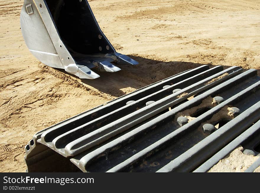 Front-end loader equipment in a construction site in a residential area. Front-end loader equipment in a construction site in a residential area.