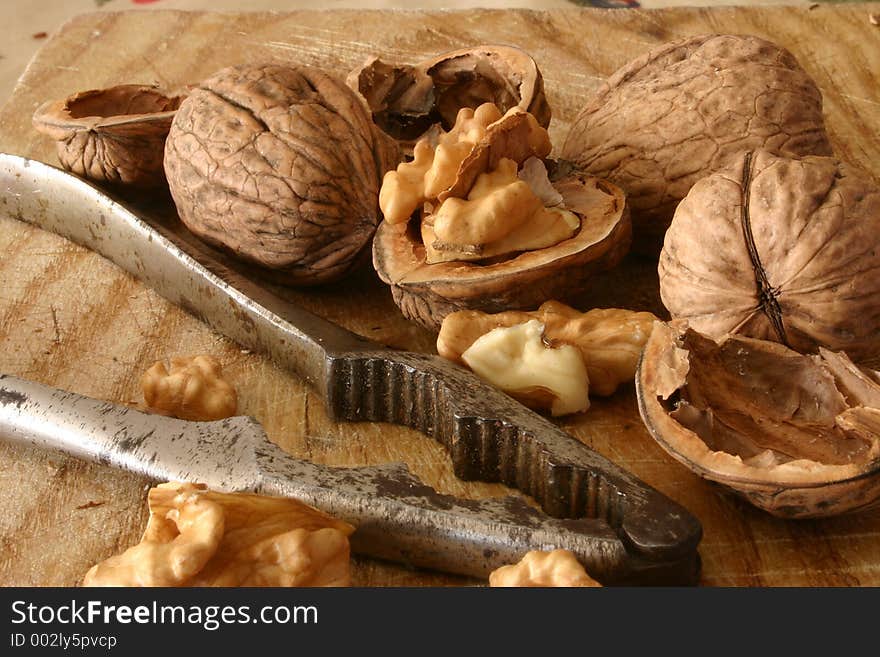 Walnuts and nutcracker close-up